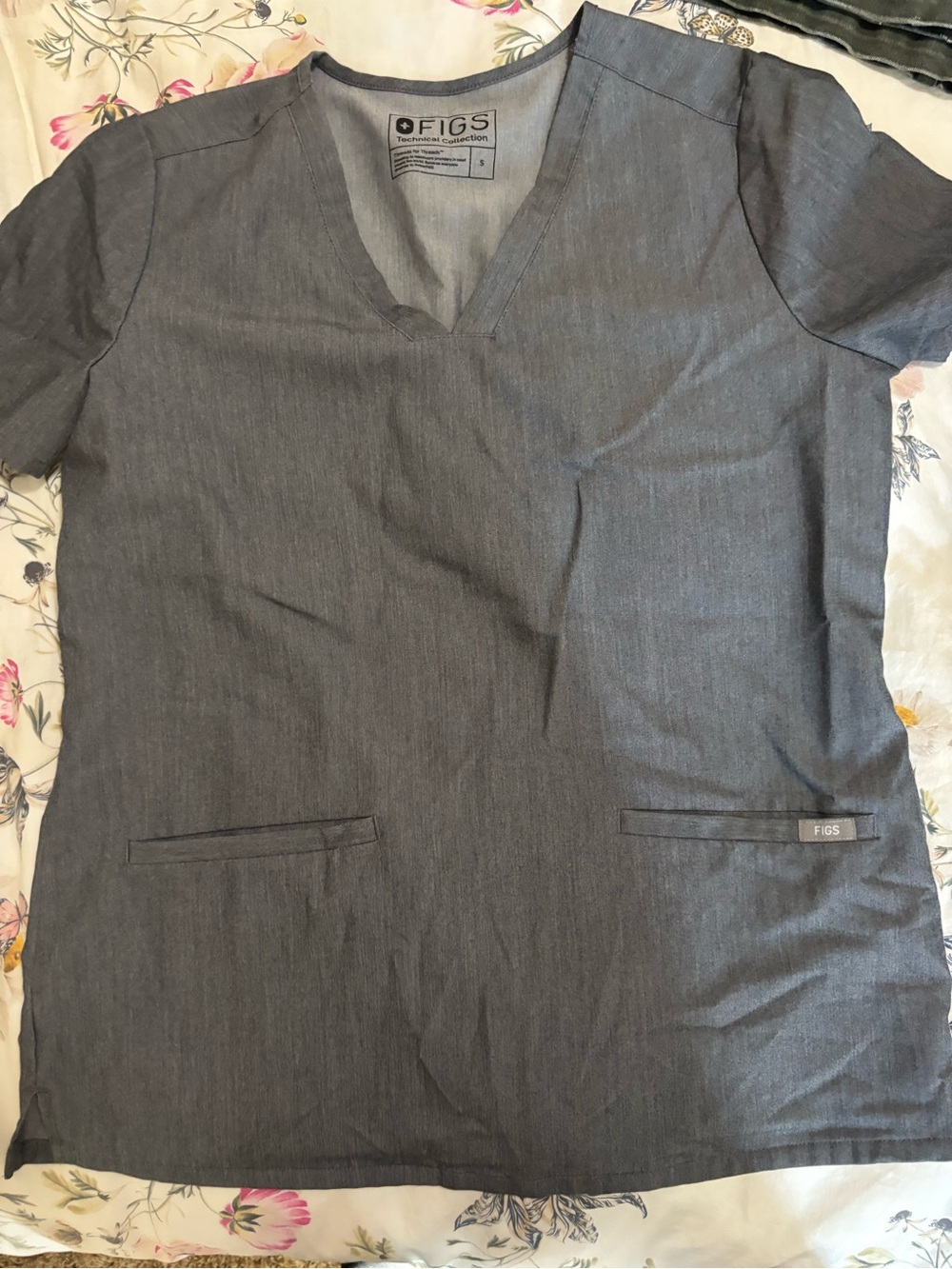 FIGS Women’s Dark Gray V-Neck Short Sleeve Scrub Top and three matching bottoms